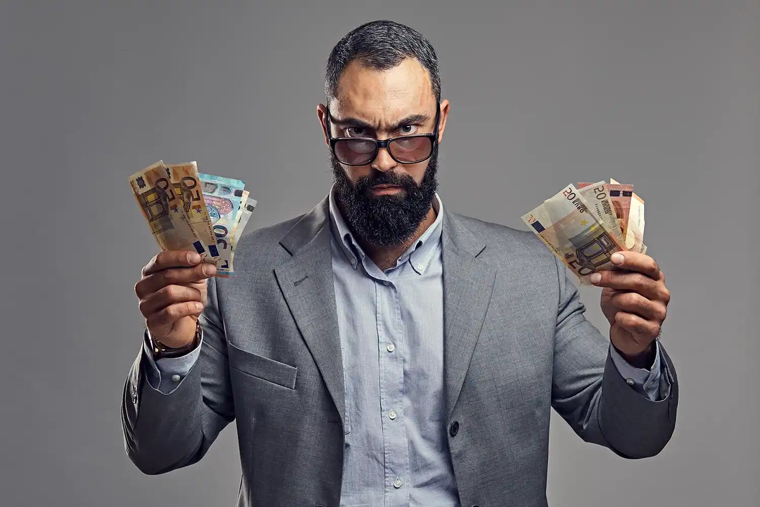 bearded-male-dressed-suit-catch-money-banknote-air.webp