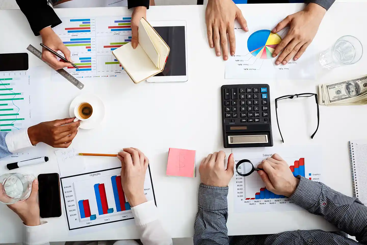 businessmen-hands-white-table-with-documents-drafts.webp